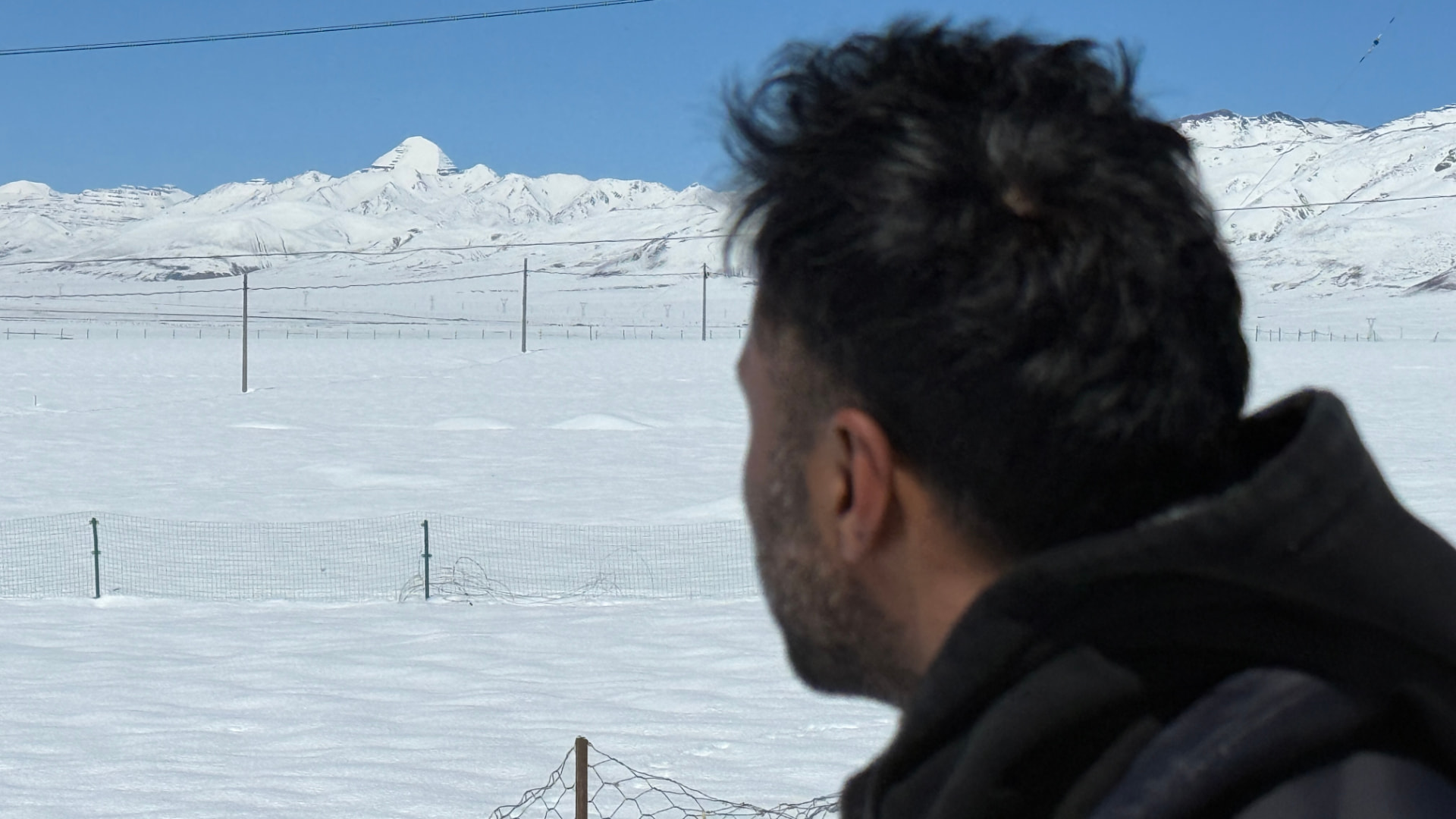 Kaivan looking toward Mount Kailash across a snow-covered plain near Darchen